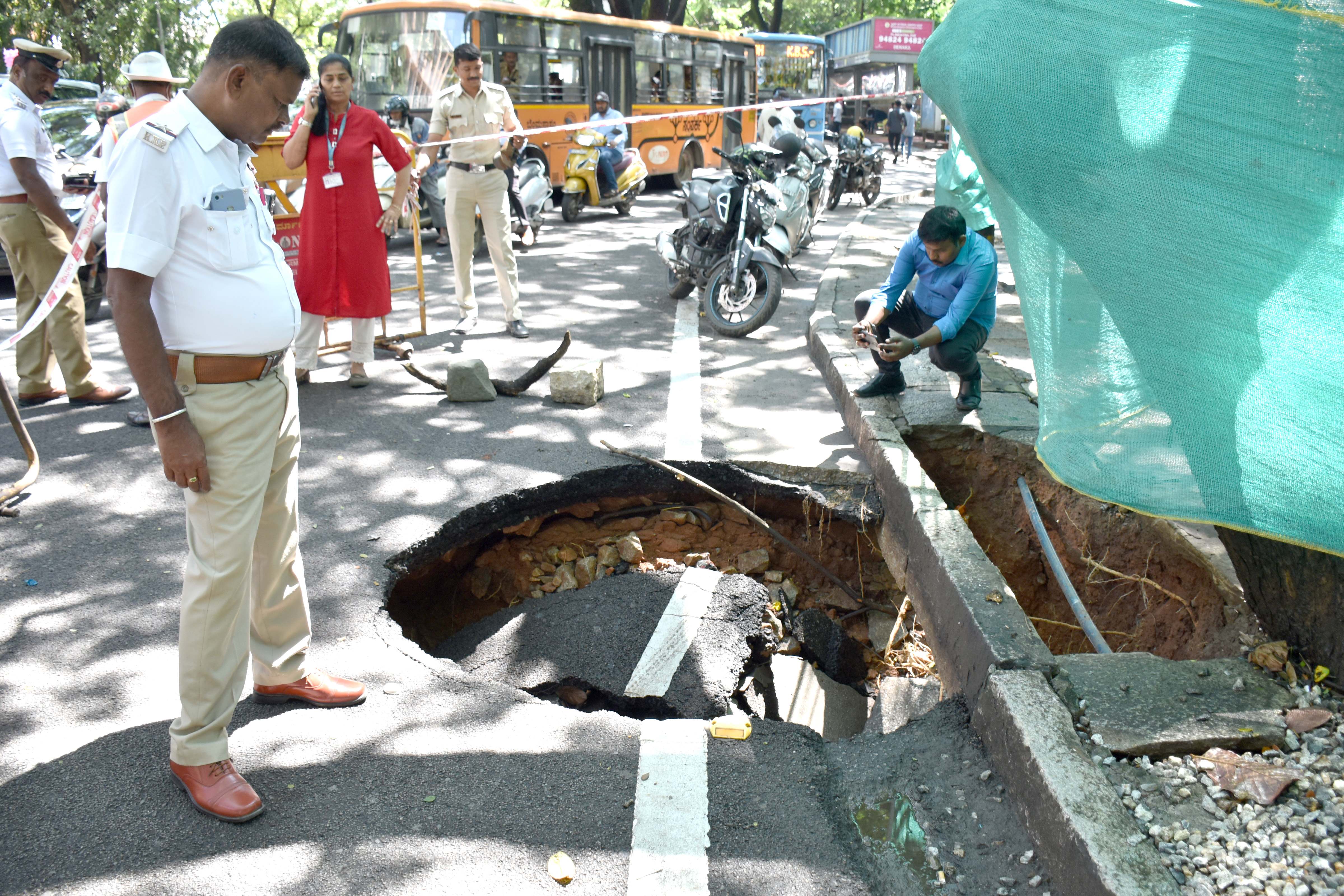 Dr B R Ambedkar Veedhi road caved following heavy rain in Bengaluru on Monday. Credit: DH Photo/ BK Janardhan