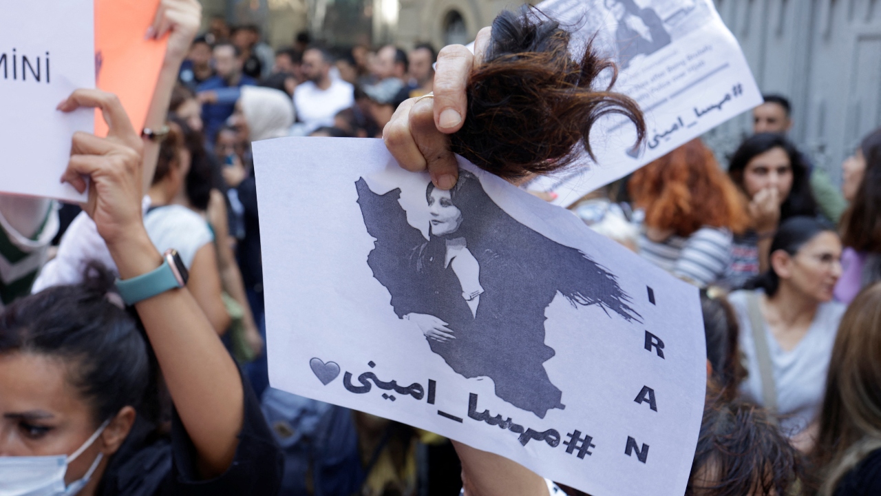 Mariam, 34, an artist in northern Manzadaran province, said she and her friends had not only burned their scarves, they had cut their long hair and shaved their heads. Credit: Reuters Photo