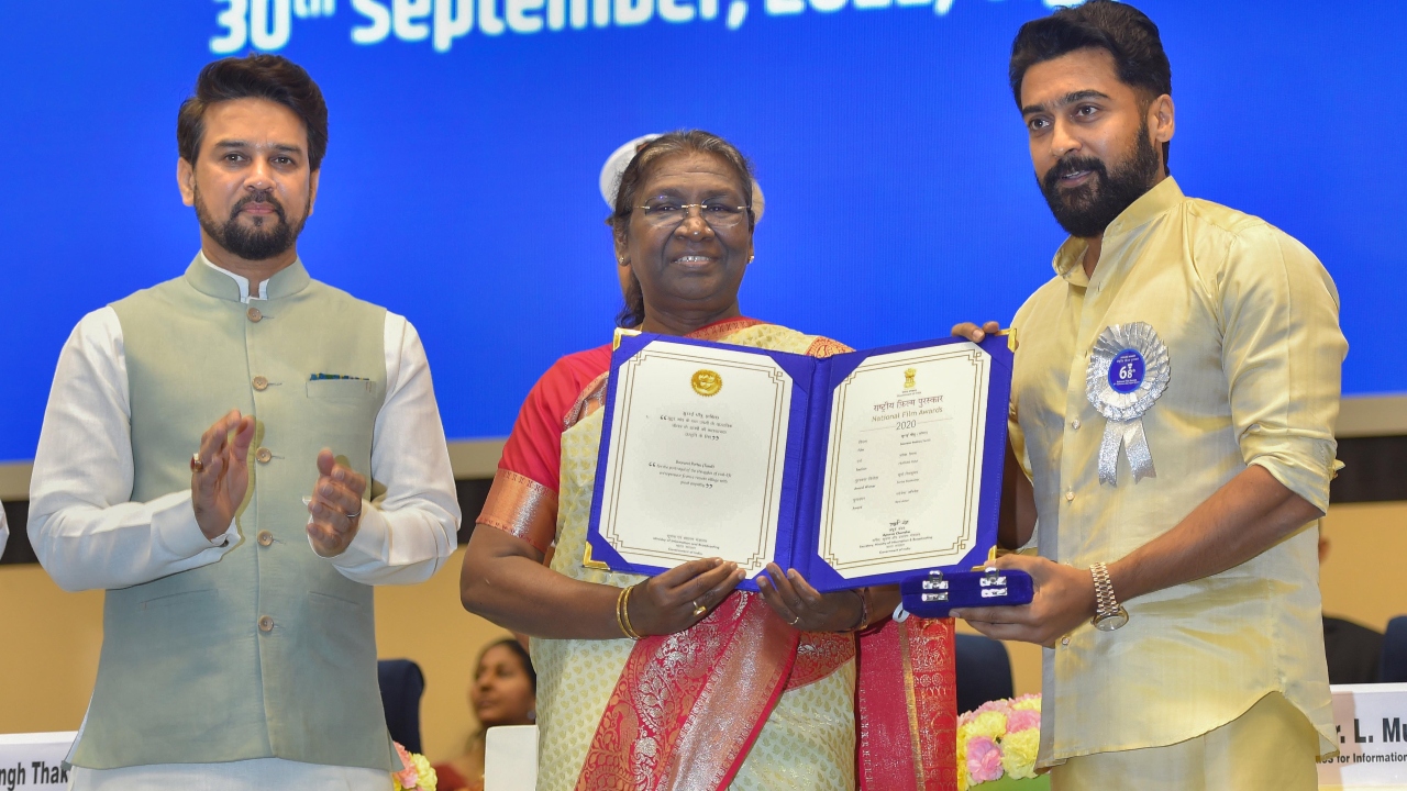 Murmu presents Best Actor Award to Tamil actor Suriya during the 68th National Film Awards presentation ceremony, at Vigyan Bhawan in New Delhi. Credit: PTI Photo