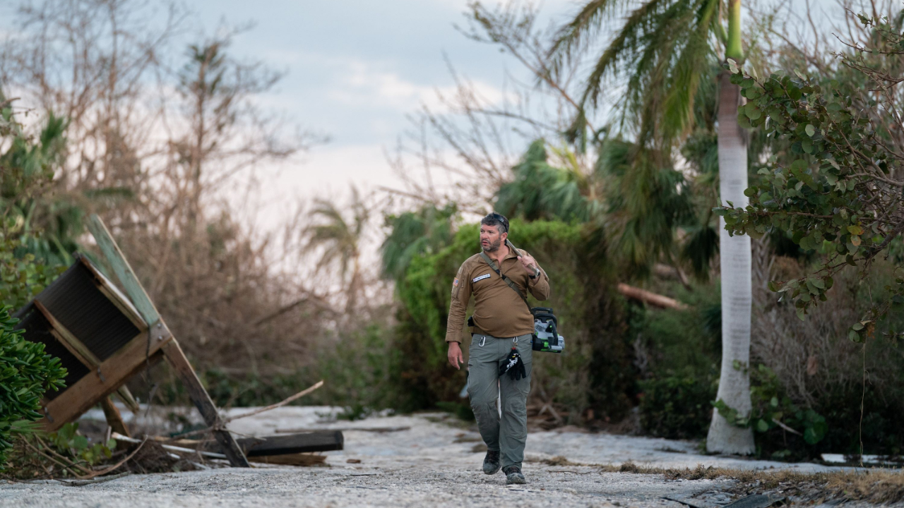 Bryan Stern, founder of the Project DYNAMO rescue organization, walks in a storm damaged neighborhood in the wake of Hurricane Ian on October 1, 2022 on Sanibel Island, Florida. Credit: Sean Rayford/Getty Images/AFP