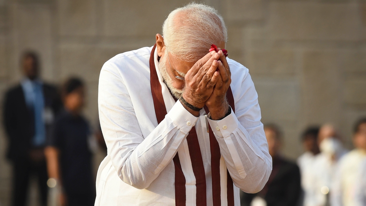 PM Narendra Modi pays homage to Mahatma Gandhi at Rajghat. Credit: PTI Photo