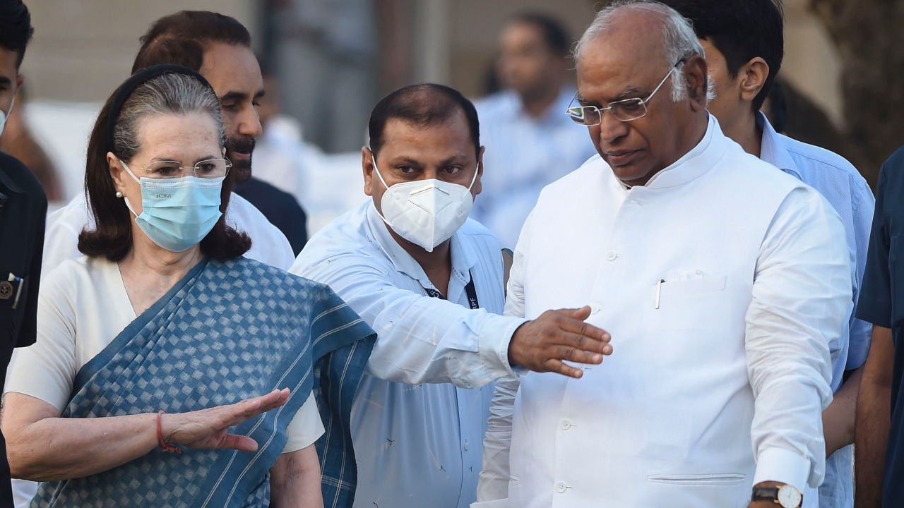 Congress interim President Sonia Gandhi with party leader Mallikarjun Kharge at Rajghat in New Delhi. Credit: PTI Photo