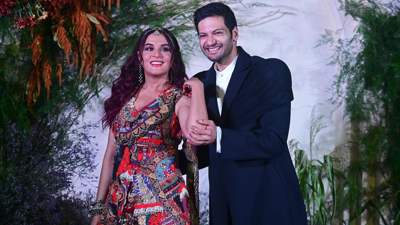 The couple distributed gifts for the media who had come to cover their wedding reception. Credit: AFP Photo