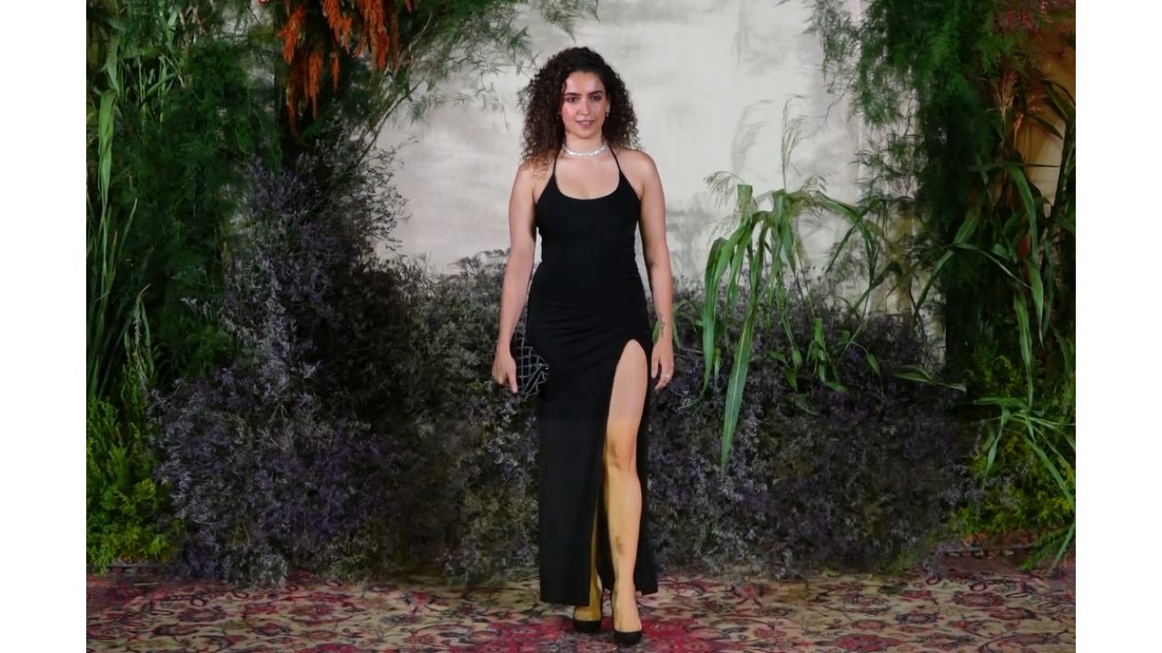 Sanya Malhotra made heads turn in a thigh-high slit black dress. Credit: Special Arrangement