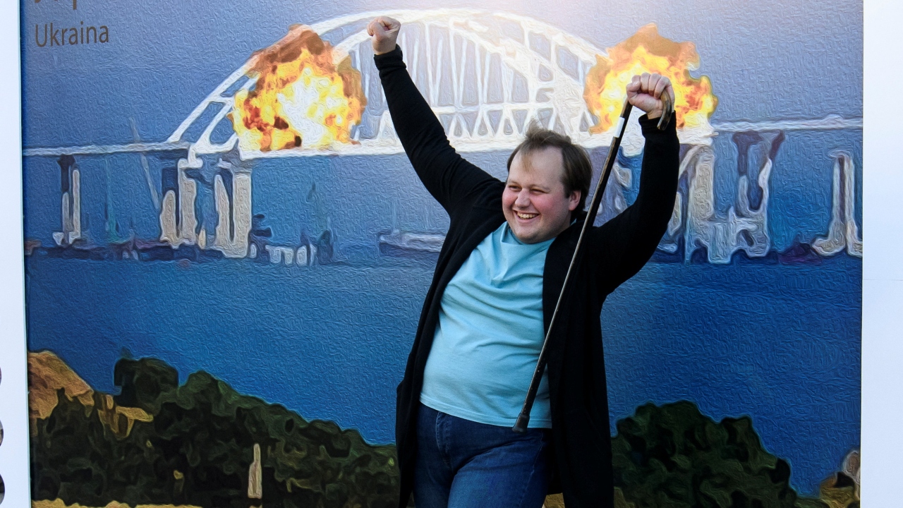 A man got himself clicked as he could be seen celebrating the blast at Kerch bridge. Credit: Reuters Photo