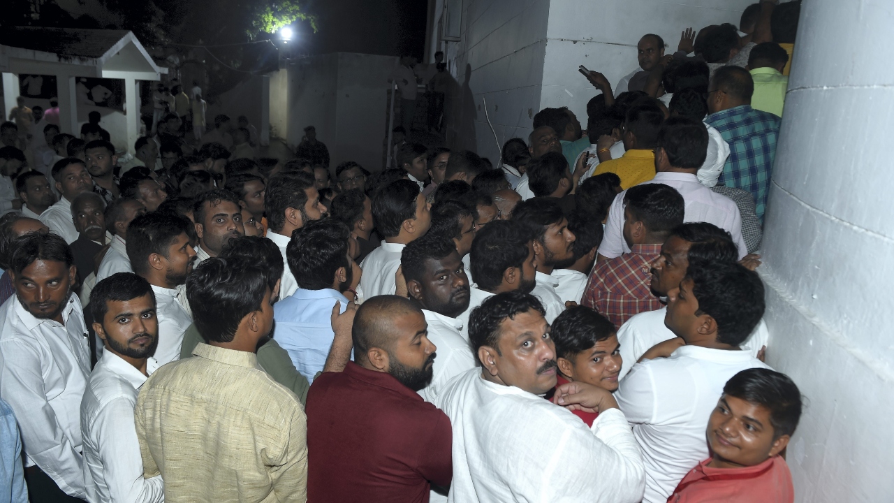People wait in queues to pay their last respects to Samajwadi Party founder in Saifai. Credit: PTI Photo