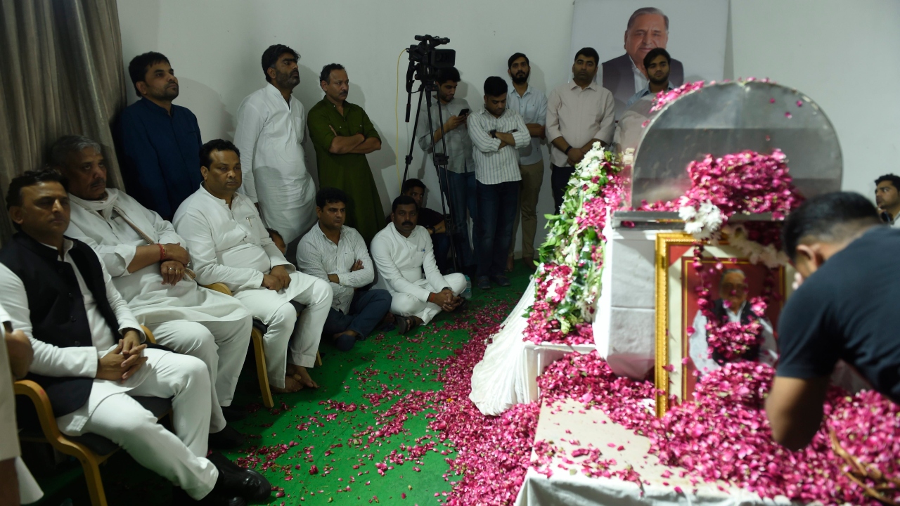 Samajwadi Party president Akhilesh Yadav, former MP Dharmendra Yadav and other family members were present when the SP patriarch's mortal remains were taken out from an ambulance. Credit: PTI Photo