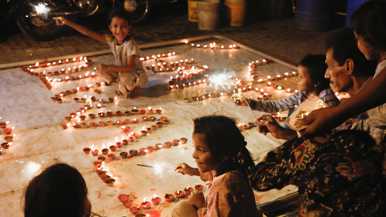 People decorated their houses with ‘diyas’ (earthen lamps), candles and electric lamps to celebrate the festival of lights. Credit: Reuters Photo