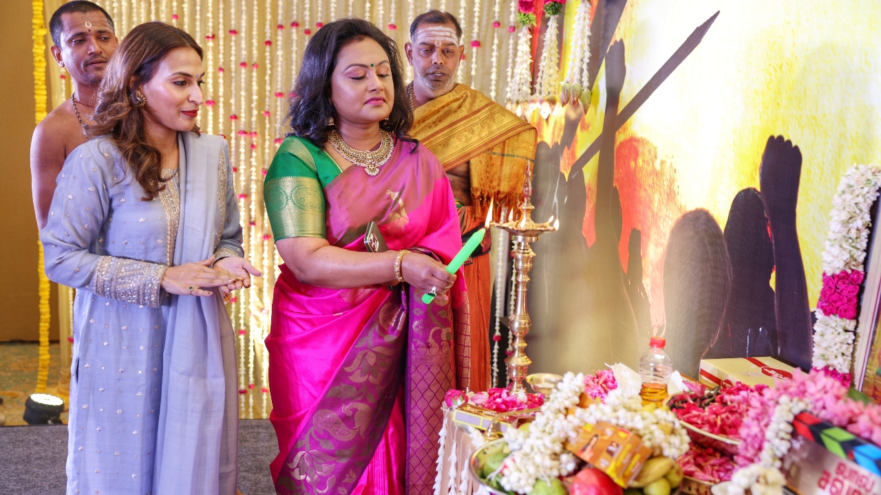 Premantharshini Subaskaran, wife of  Lyca head Subaskaran, lights the traditional lamp as Aishwarya looks on. Credit: Special Arrangement