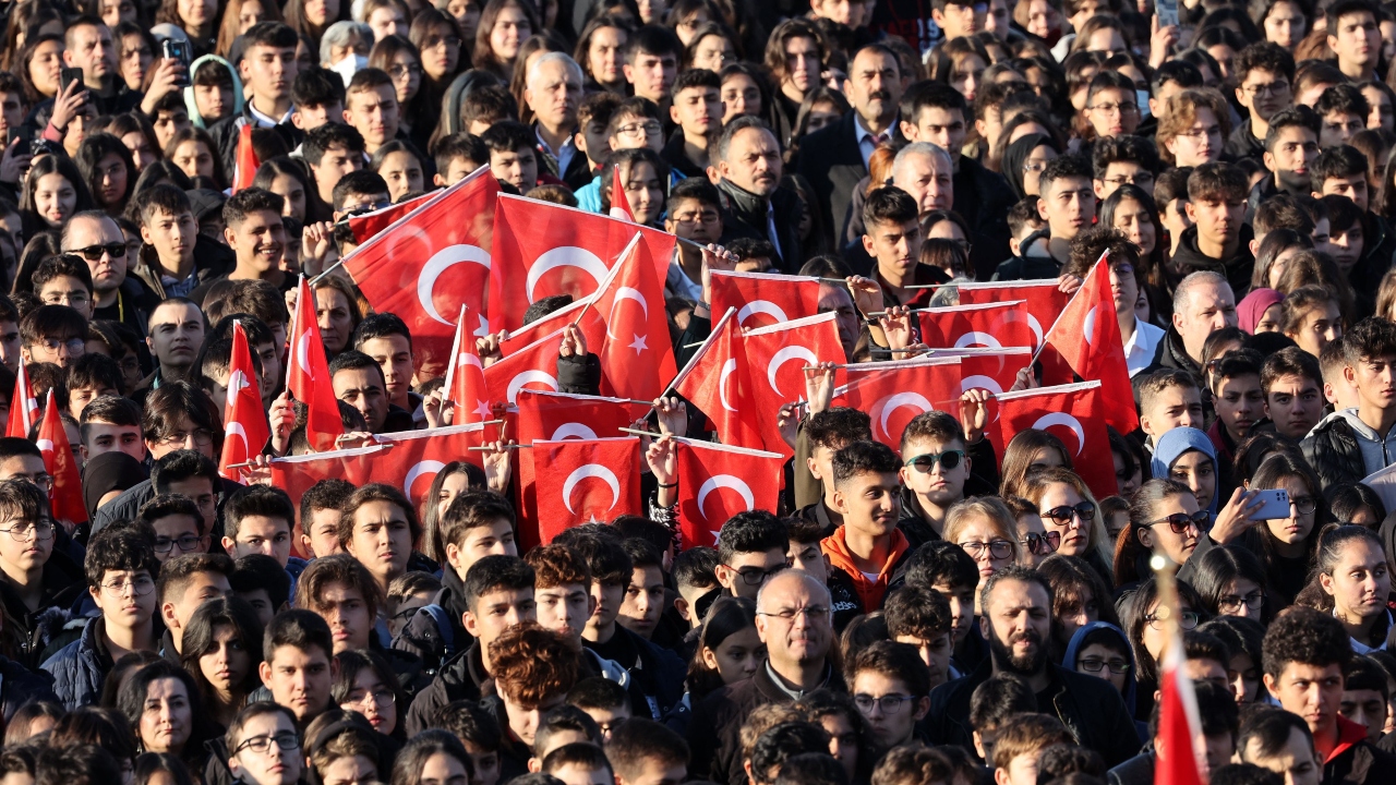 People holds Turkey's flags as they visit Anitkabir, the mausoleum of the Turkish Republic founder and first president, Mustafa Kemal Ataturk, to mark the 84th anniversary of his death in Ankara, on November 10, 2022. Credit: AFP Photo
