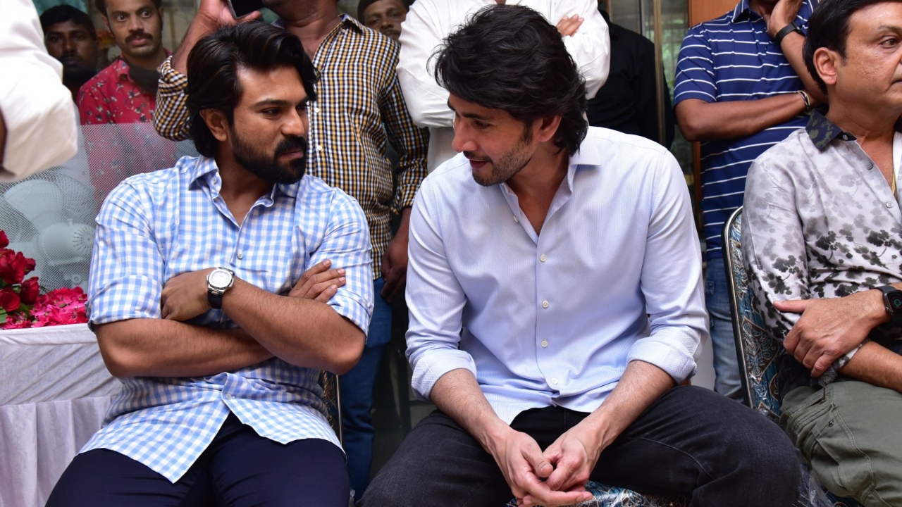 Ram Charan interacts with Mahesh Babu after paying his tribute to the mortal remains of actor Krishna in Hyderabad. Credit: Special Arrangement