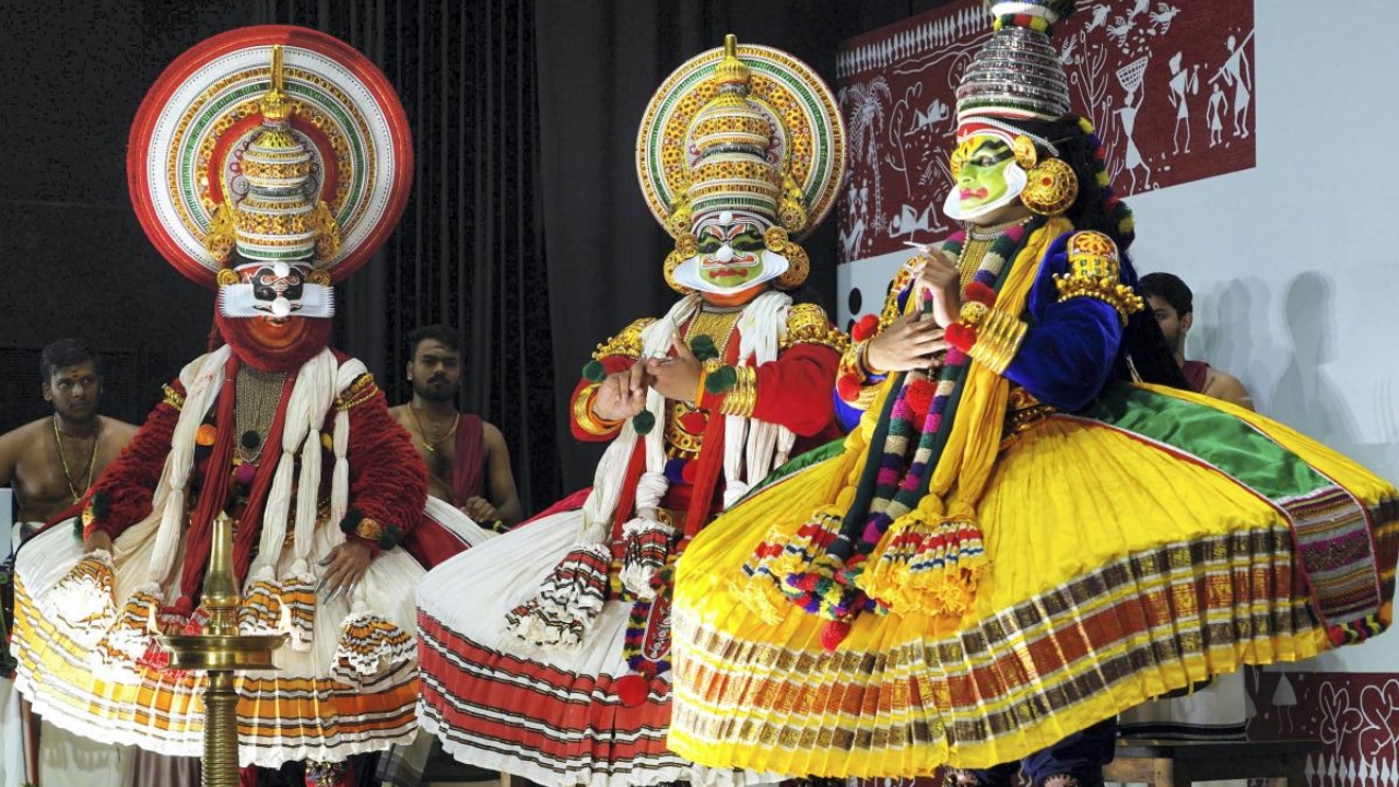 rtist dressed as 'Kathakali' dancers during a cultural event in Kochi. Credit: PTI Photo