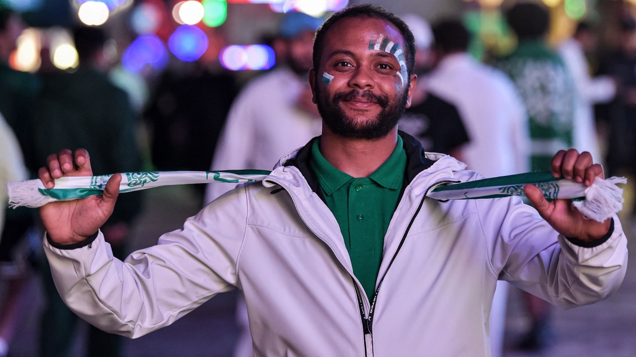 A Saudi football fan with face paint poses during celebrations of Saudi Arabia's win over Argentina in the Qatar 2022 World Cup in Riyadh. Credit: AFP Photo