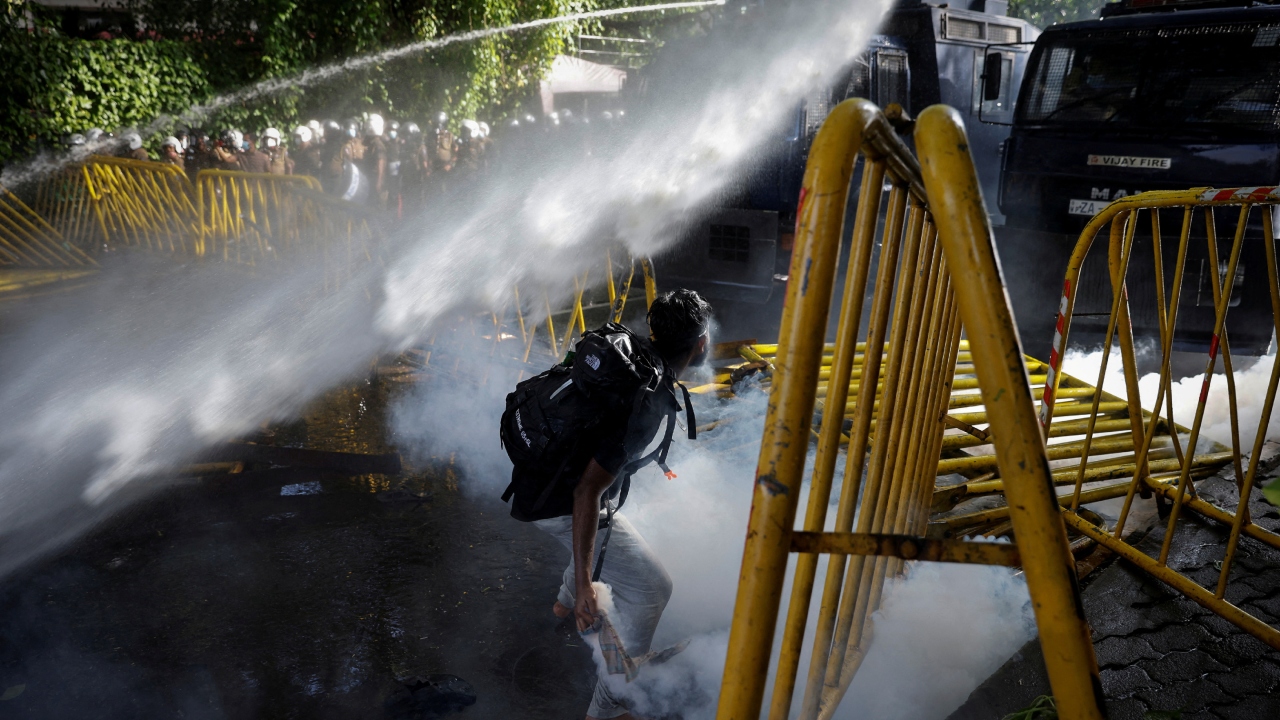 A protestor throws back a tear gas canister towards the police during a protest organized by students near the President's House, amid the country's economic crisis, in Colombo, Sri Lanka. Credit: Reuters Photo