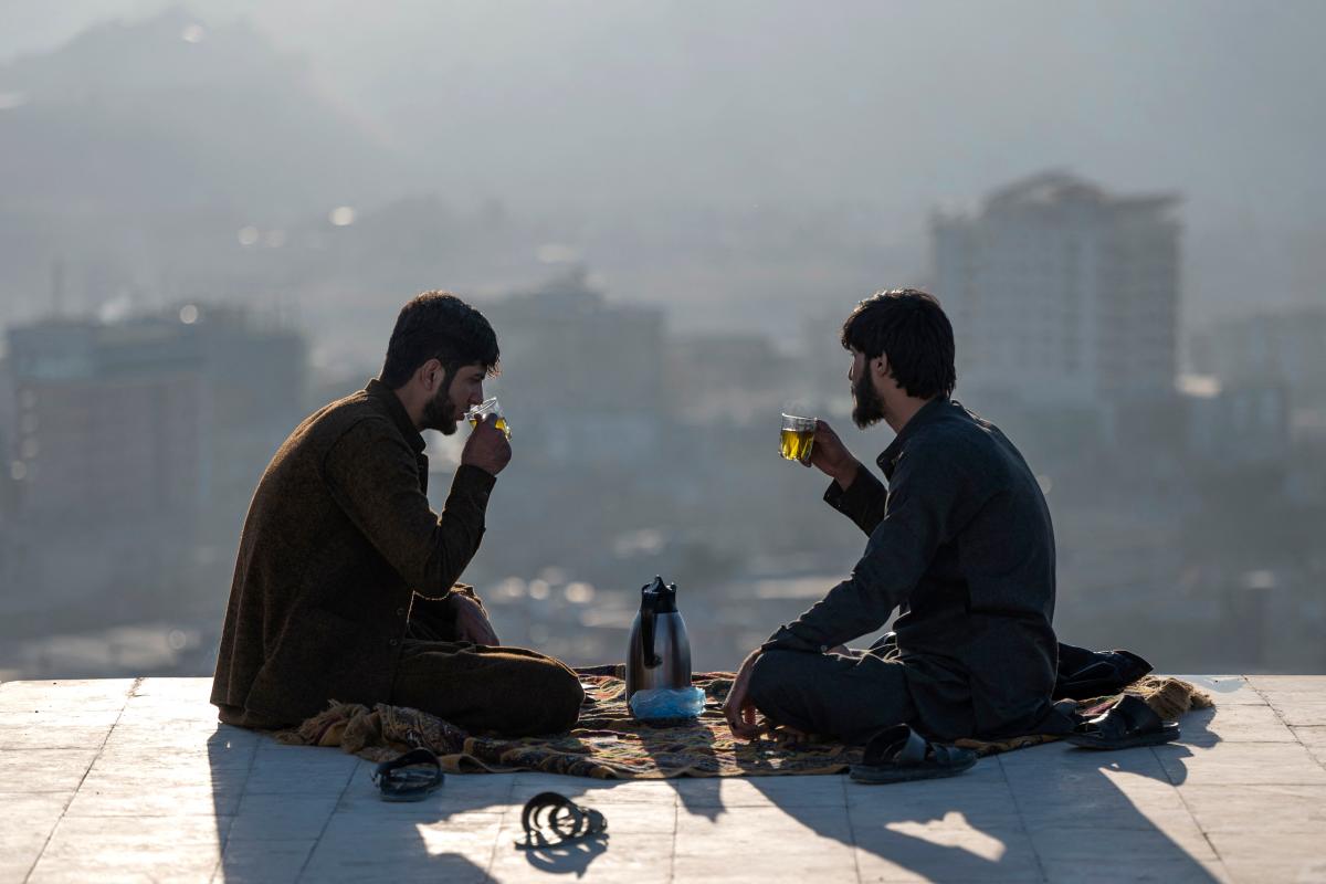 Afghan men drink tea at Nadir Khan hilltop overlooking Kabul. Credit: AFP Photo