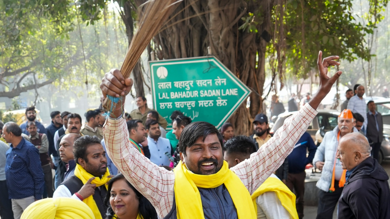 AAP supporters celebrate their party's win at the the MCD elections, in New Delhi. Credit: PTI Photo