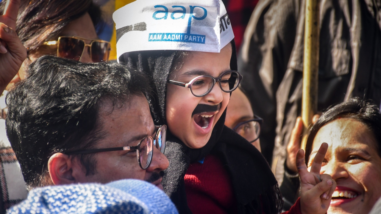 AAP supporters celebrate MCD election results at the party head office, in New Delhi. Credit: PTI Photo