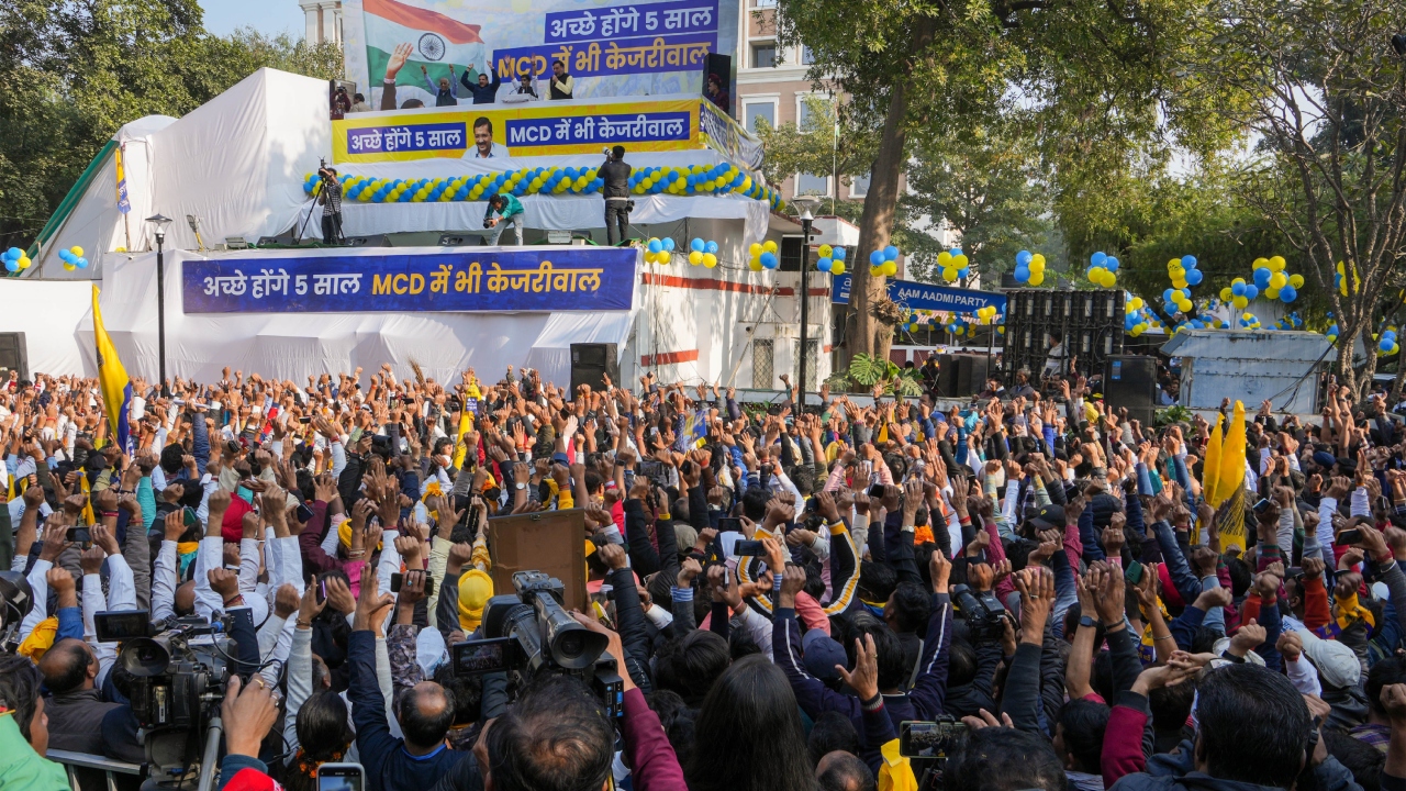 AAP supporters during celebrations after party crossed the majority mark in the MCD polls, at the party headquarters in New Delhi. Credit: PTI Photo