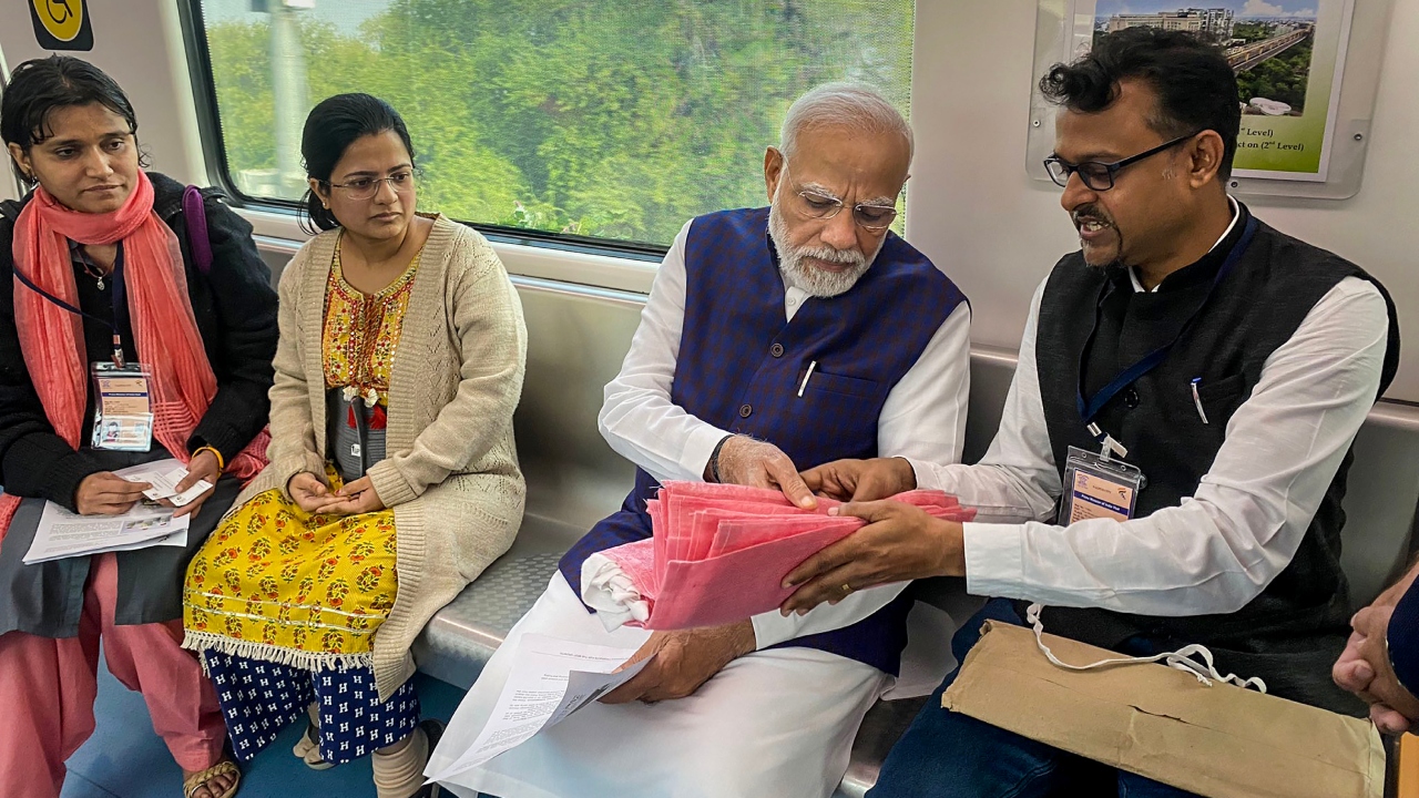 PM Modi interacted with passengers during his ride from Freedom Park Metro station to Khapri Metro Station, in Nagpur. Credit: Twitter/@CMOMaharashtra