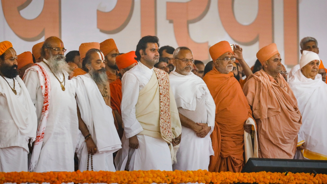 Spiritual leaders attend the swearing-in ceremony of Gujarat Chief Minister and Cabinet Ministers, in Gandhinagar. Credit: PTI Photo