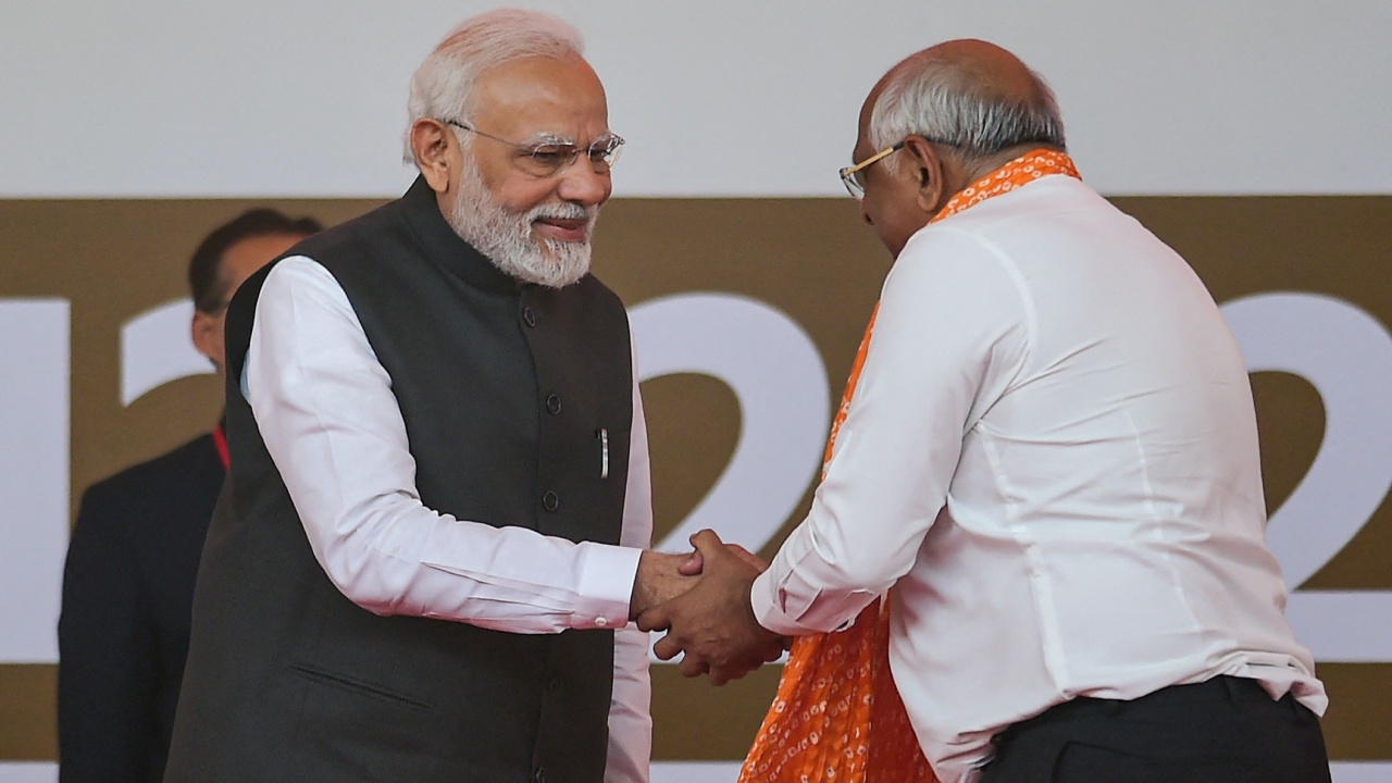 Prime Minister Narendra Modi being greeted by BJP leader Bhupendra Patel during the latter's oath-taking ceremony as Gujarat Chief Minister, in Gandhinagar. Credit: Twitter/@BJP4India