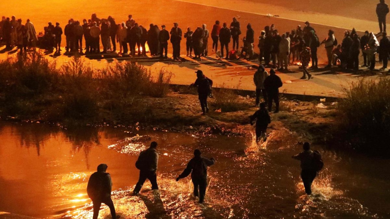 Migrants travelling in a caravan of more than a thousand people from countries such as Nicaragua, Peru, Ecuador, Colombia, Venezuela and the Dominican Republic cross the Rio Bravo river (or Rio Grande river, as it is called in the US) to ask for political asylum in the United States, in Ciudad Juarez, Chihuahua state, Mexico. Credit: AFP Photo