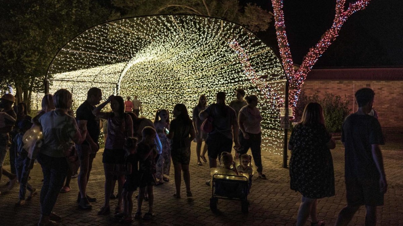 Visitors gather at a Christmas light fair at the Abraham Kriel Children's home in Potchefstroom, Sout Africa. Credit: AFP Photo