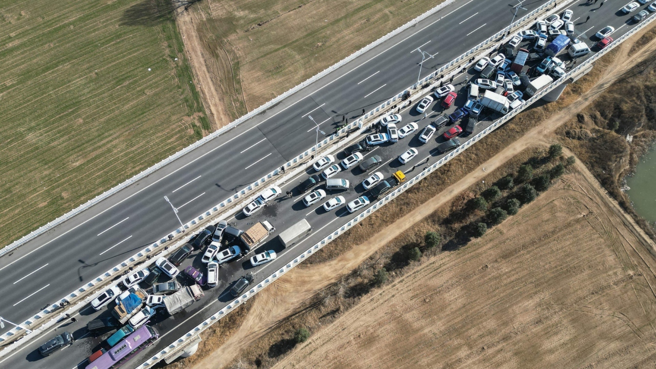 Several cars and trucks could been seen crumpled and piled on top of each other on the Zhengxin Huanghe bridge in pictures and videos on social media. Credit: AFP Photo