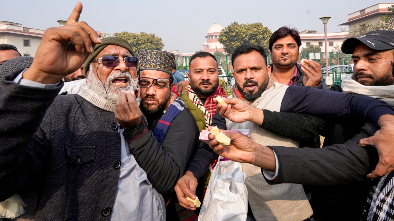 Local people from Haldwani celebrated with sweets after the Supreme Court order on Haldwani eviction case in New Delhi. Credit: PTI Photo