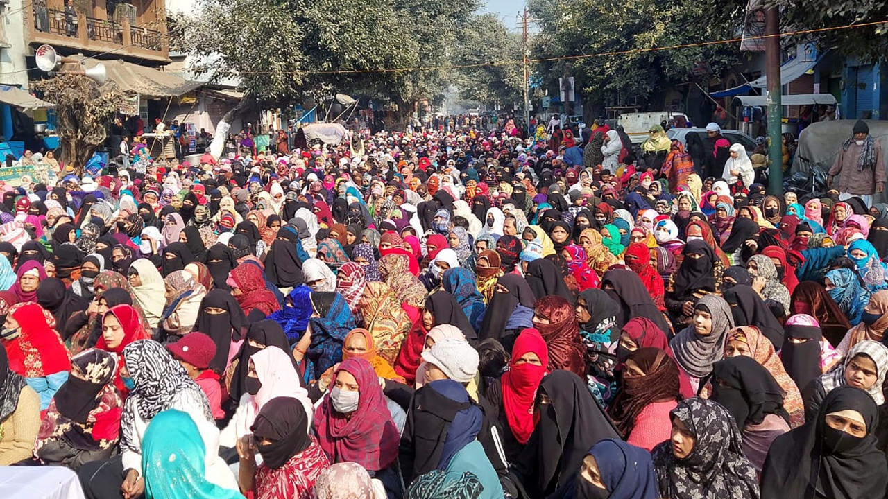As the news came in, men, women and children sitting on a dharna in front of a mosque ended the protest and hugged each other. Local residents started preparing tea and distributing sweets and dates to the crowd. Credit: PTI Photo