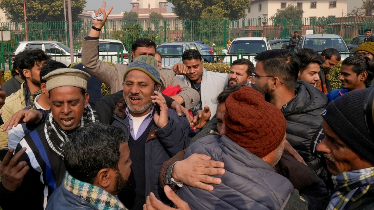 People facing demolition of their homes in Haldwani’s Banbhoolpura hugged and shared sweets after hearing the Supreme Court's verdict on January 5. The SC has stayed the Uttarakhand High Court order to remove encroachments from 29 acres of railway land. Credit: PTI Photo