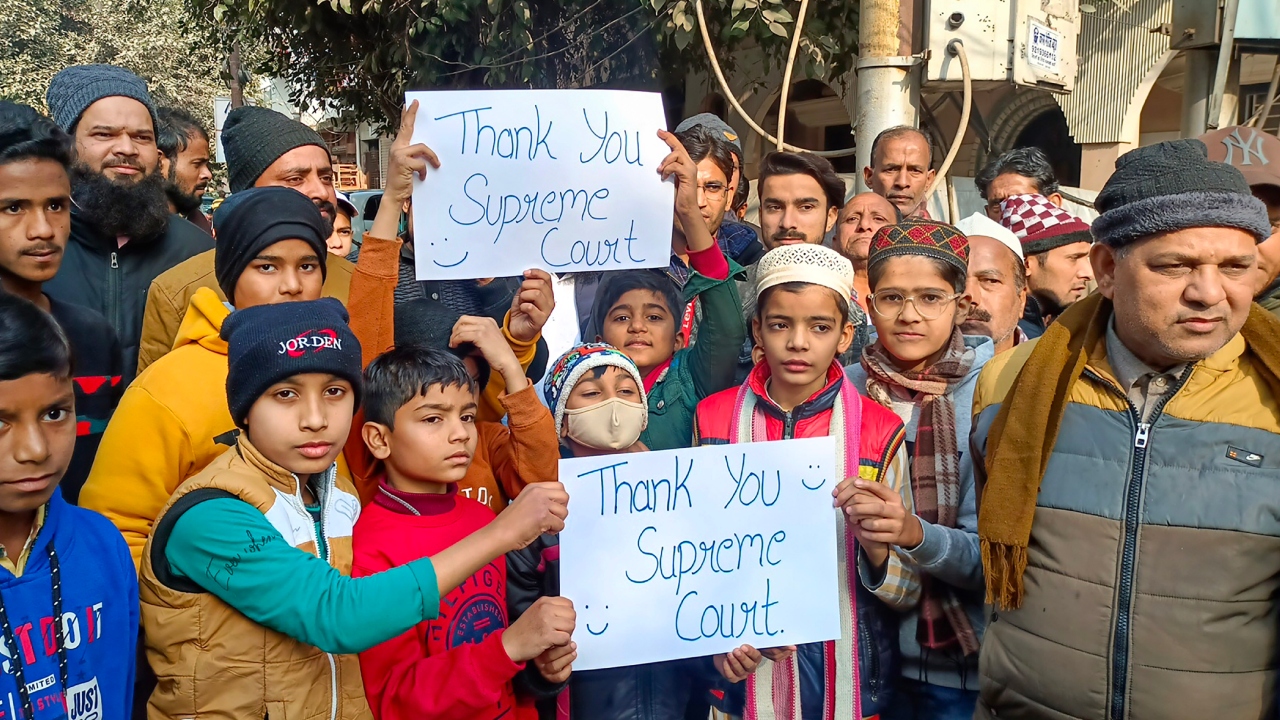 Some people were seen waving the national flag in celebration. A bunch of children held up banners saying,