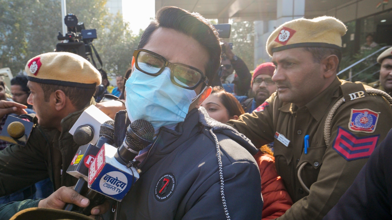Shankar Mishra, accused of urinating on a woman passenger on an Air India flight from New York to Delhi, being taken away by the police from the DCP office at IGI Airport in New Delhi. Credit: PTI Photo