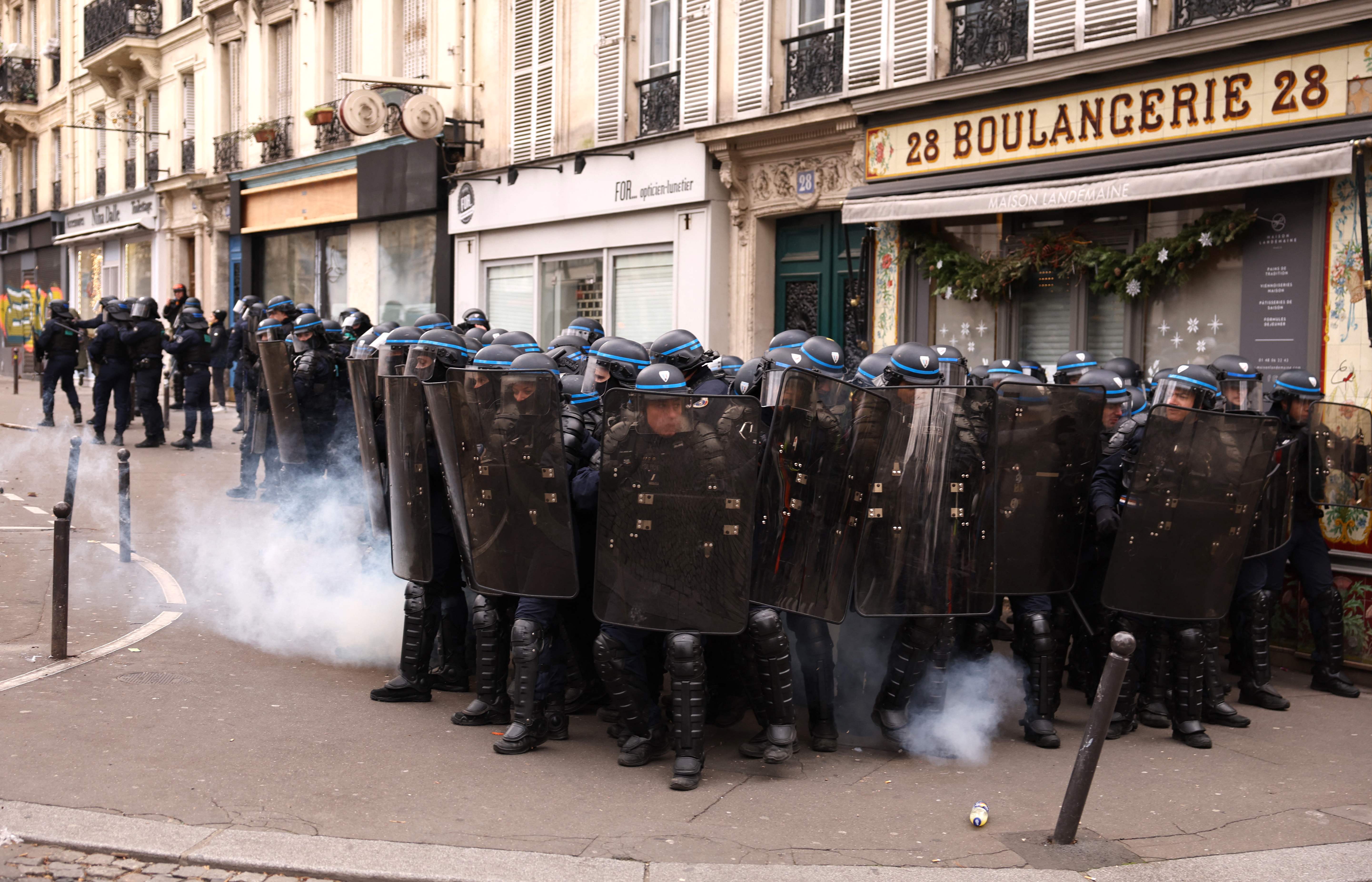 Riot police take position during a protest in Paris. Credit: AFP Photo