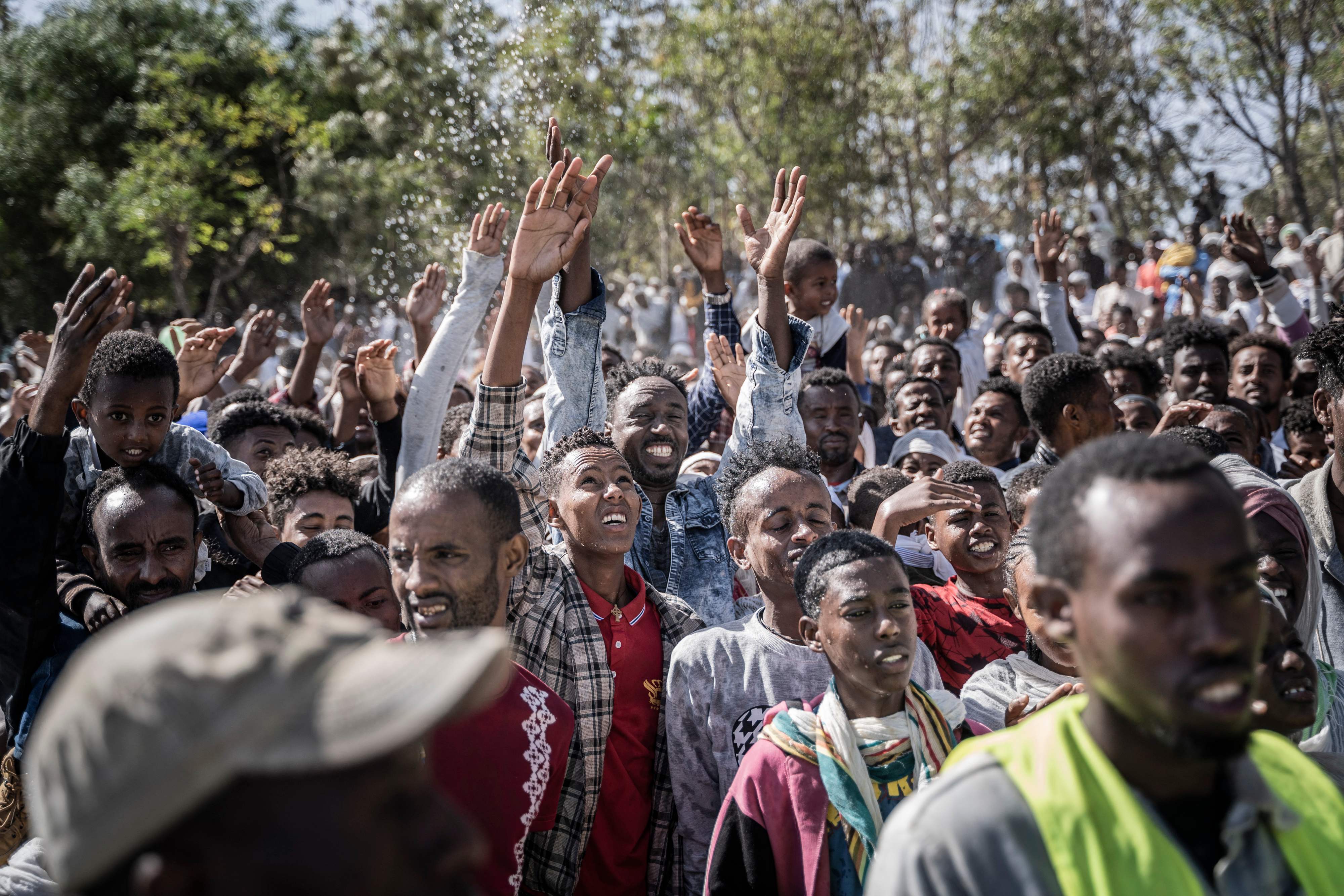 Ethiopian Orthodox worshippers get holy water sprayed on their faces during the celebration of the Ethiopian Epiphany on lake Ziway, also known as lake Dembel, Ethiopia. Credit: AFP Photo