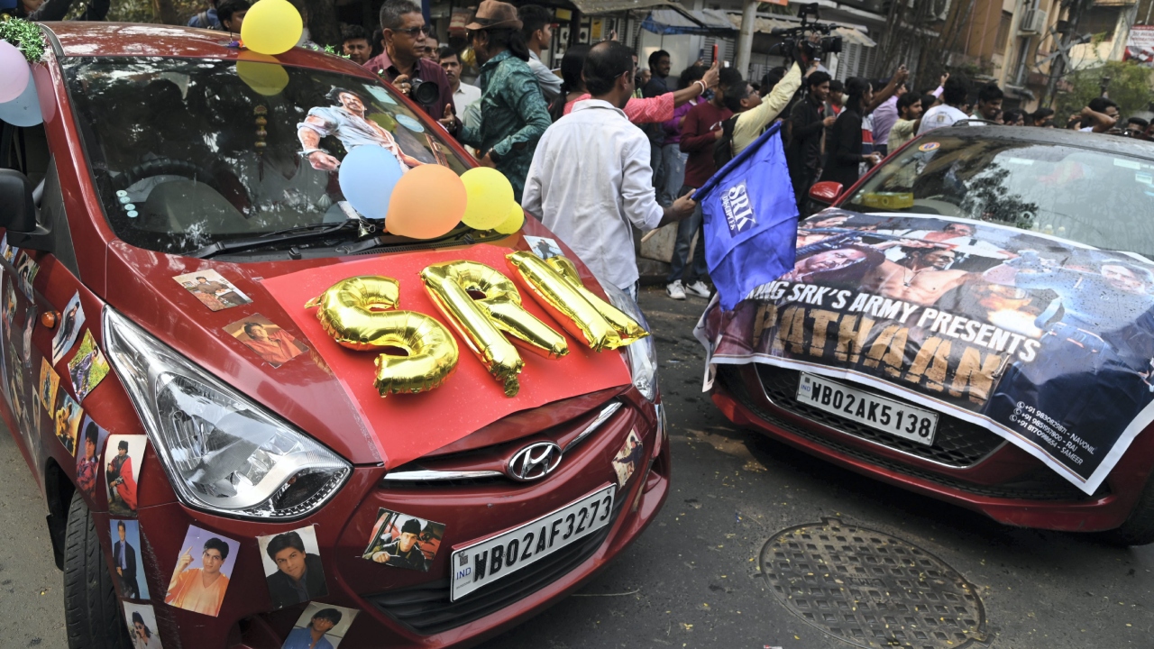 Fans of Bollywood star actor Shah Rukh Khan celebrate the release of his movie 'Pathaan', in Kolkata. Credit: PTI Photo