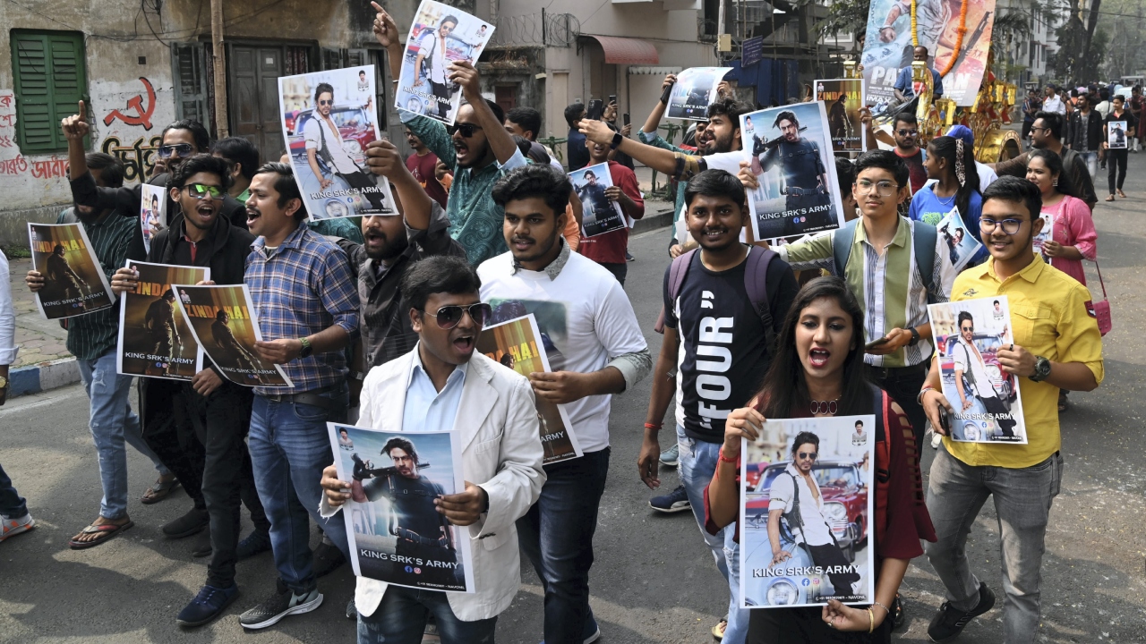 Fans of Bollywood star actor Shah Rukh Khan carry out a procession to celebrate the release of his movie 'Pathaan', in Kolkata. Credit: PTI Photo