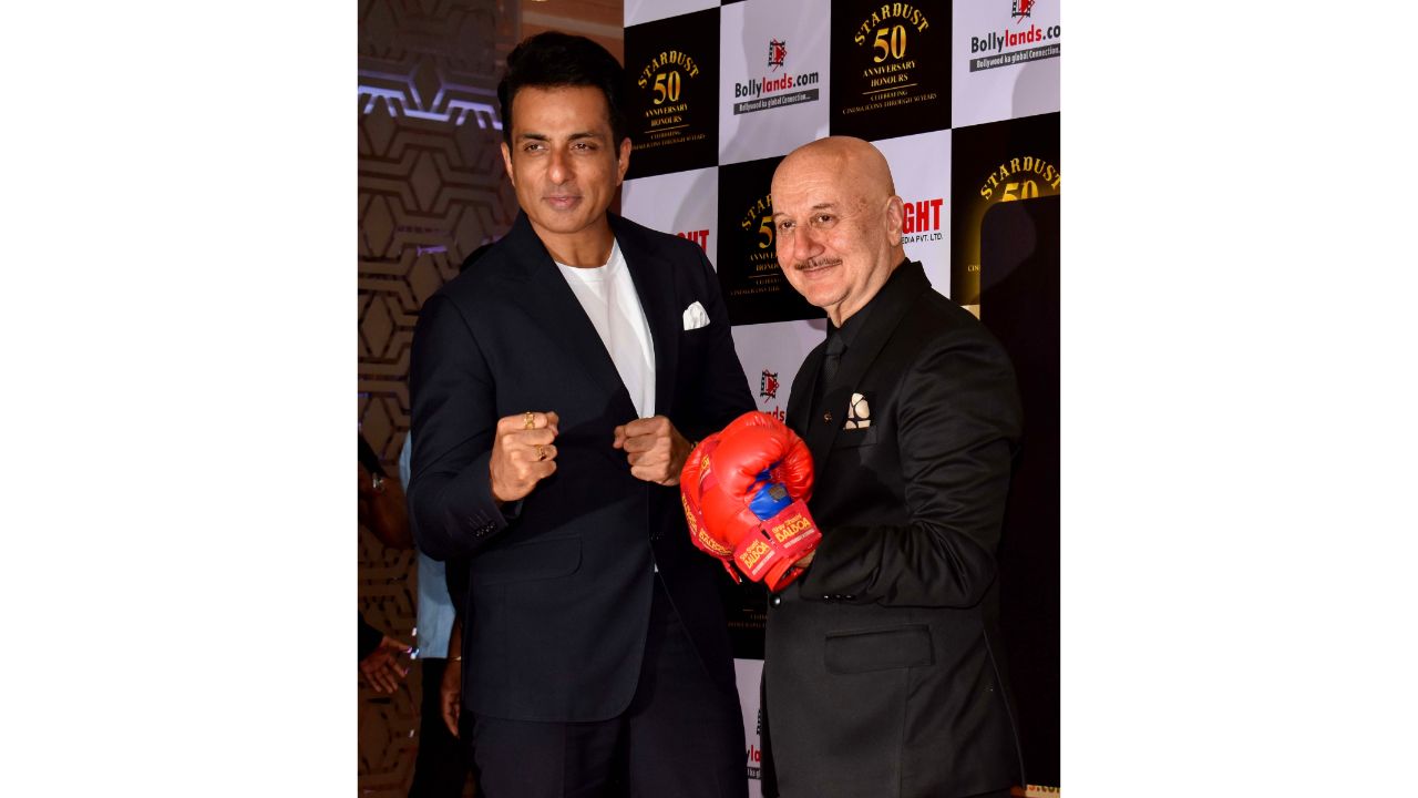 Sonu Sood poses on the red carpet with Anupam Kher during Stardust magazine's 50th anniversary party in Mumbai. Credit: PTI Photo