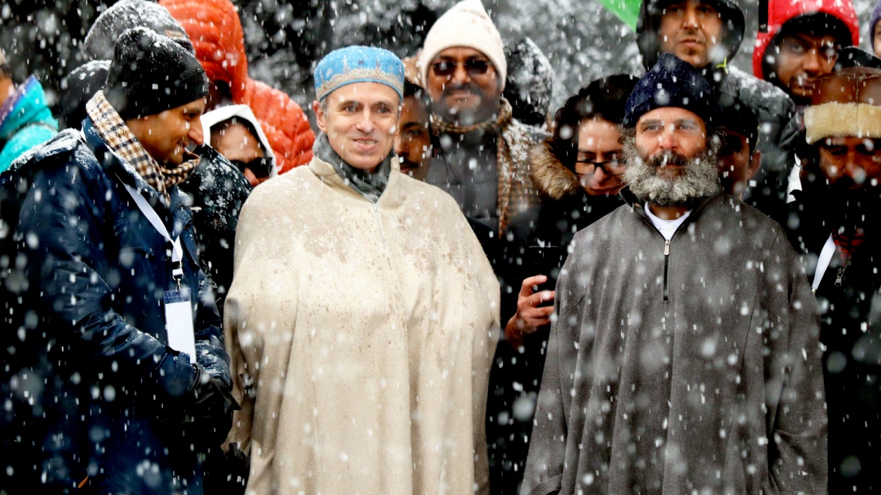 The former Congress president was seen in a sleeveless jacket over his trademark white T-shirt earlier in the morning and then in the traditional long cloak worn by Kashmiris. Credit: PTI Photo