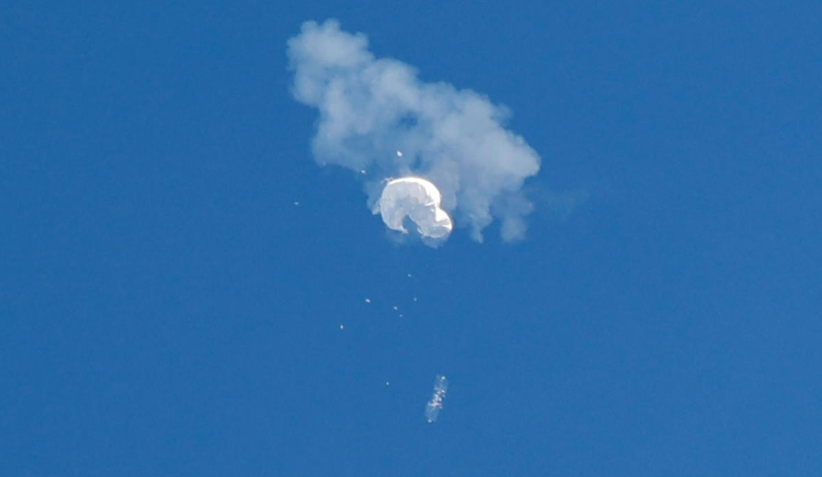 The suspected Chinese spy balloon drifts to the ocean after being shot down off the coast in Surfside Beach, South Carolina. Credit: Reuters Photo