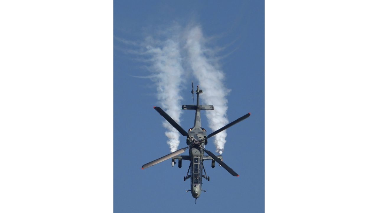 Indian Air Force's (IAF) Light Combat Helicopter (LCH) performs during the inauguration of Aero India 2023, at Yelahanka air base in Bengaluru. Credit: PTI Photo