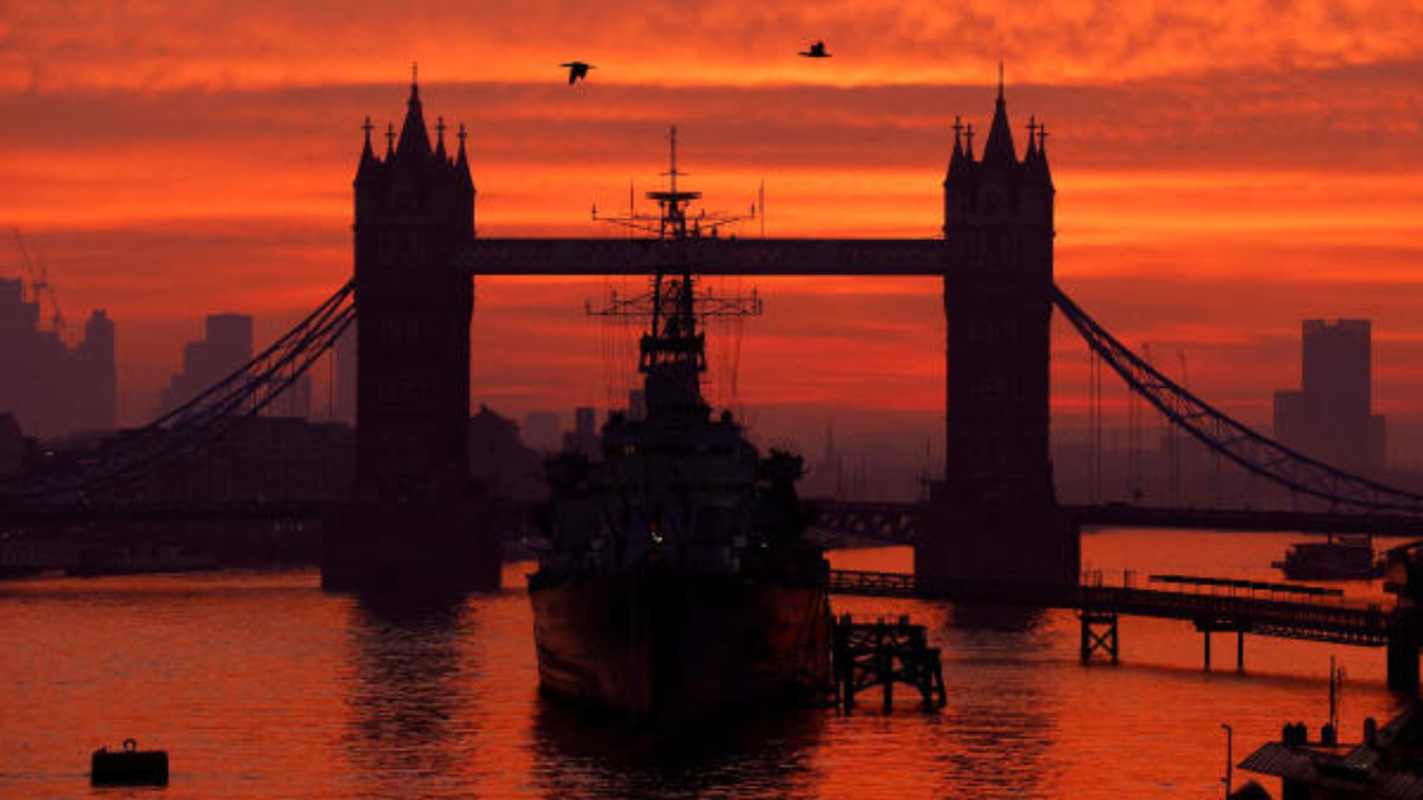 Tower bridge and HMS Belfast are seen at dawn in London. Credit: Reuters Photo