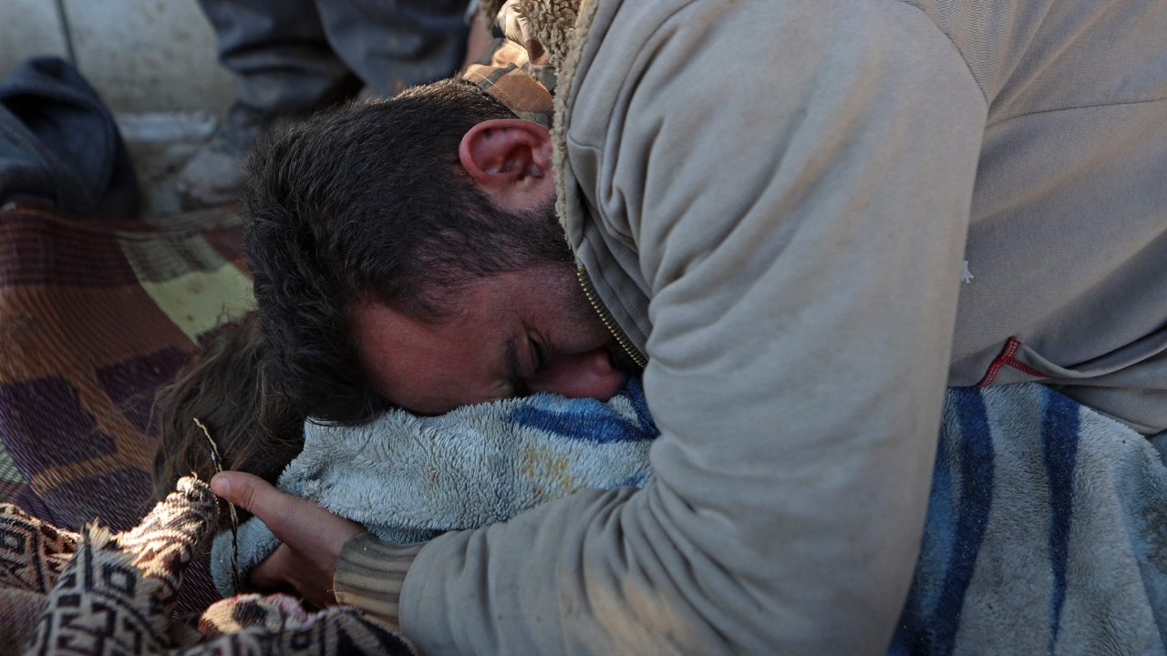 A Syrian man cries over the body of his child in the Jindayris, Syria. Credit: AFP Photo