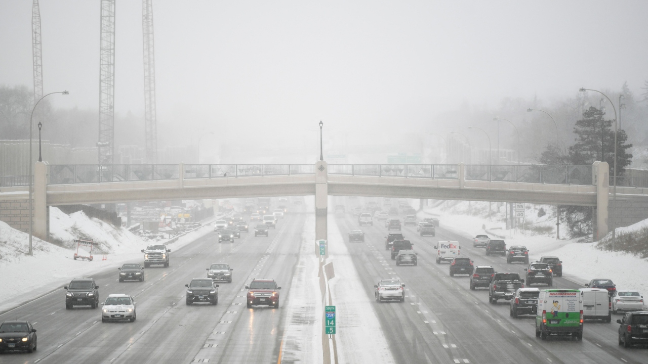 Traffic is moving on interstate 35W during a snowstorm in Minneapolis, Minnesota, on February 22, 2023. Credit: AFP Photo