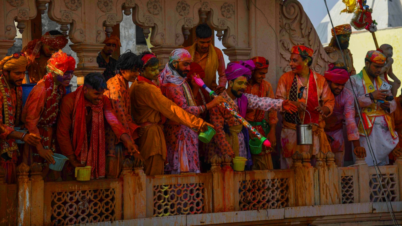 People play with colours during the traditional 'Lathmar Holi' in Barsana, UP. Credit: PTI Photo