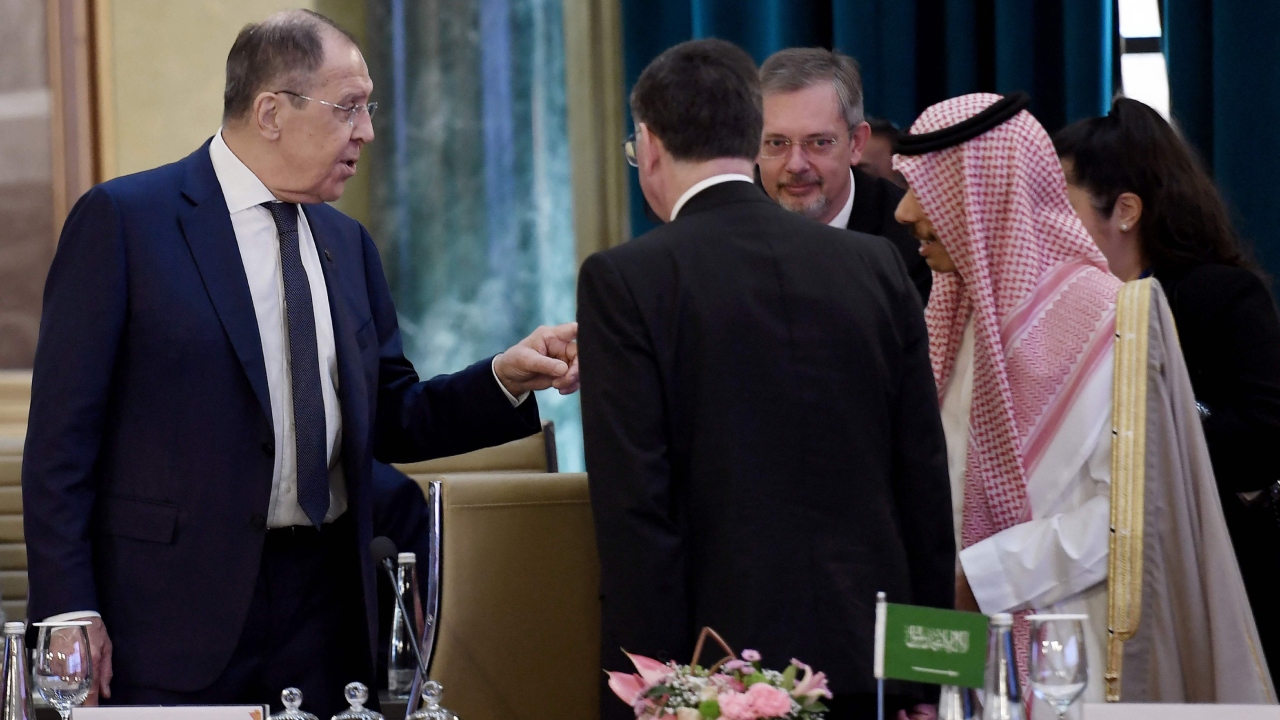 Russian Foreign Minister Sergei Lavrov speaks with Saudi Arabia's Foreign Minister Prince Faisal bin Farhan during the G20 Foreign Ministers' Meeting in New Delhi. Credit: AFP Photo