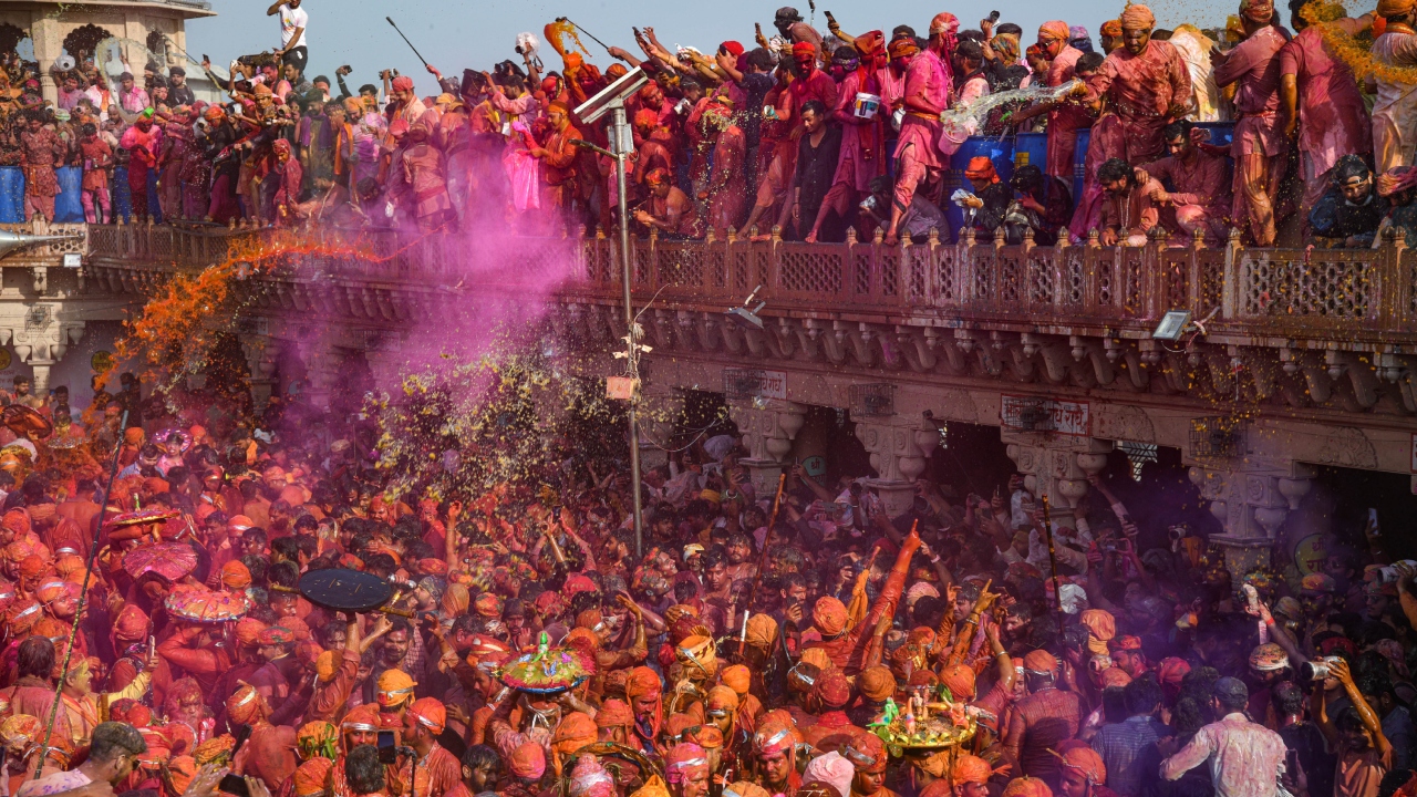 People play with colours ahead of traditional 'Lathmar Holi', in Nandgaon. Credit: PTI Photo