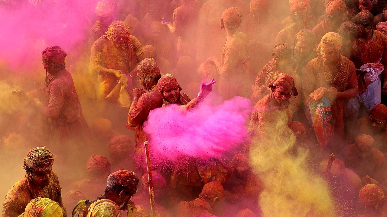 People play with colours as they take part in the religious festival of Holi inside a temple at Nandgaon village, in Uttar Pradesh. Credit: Reuters Photo