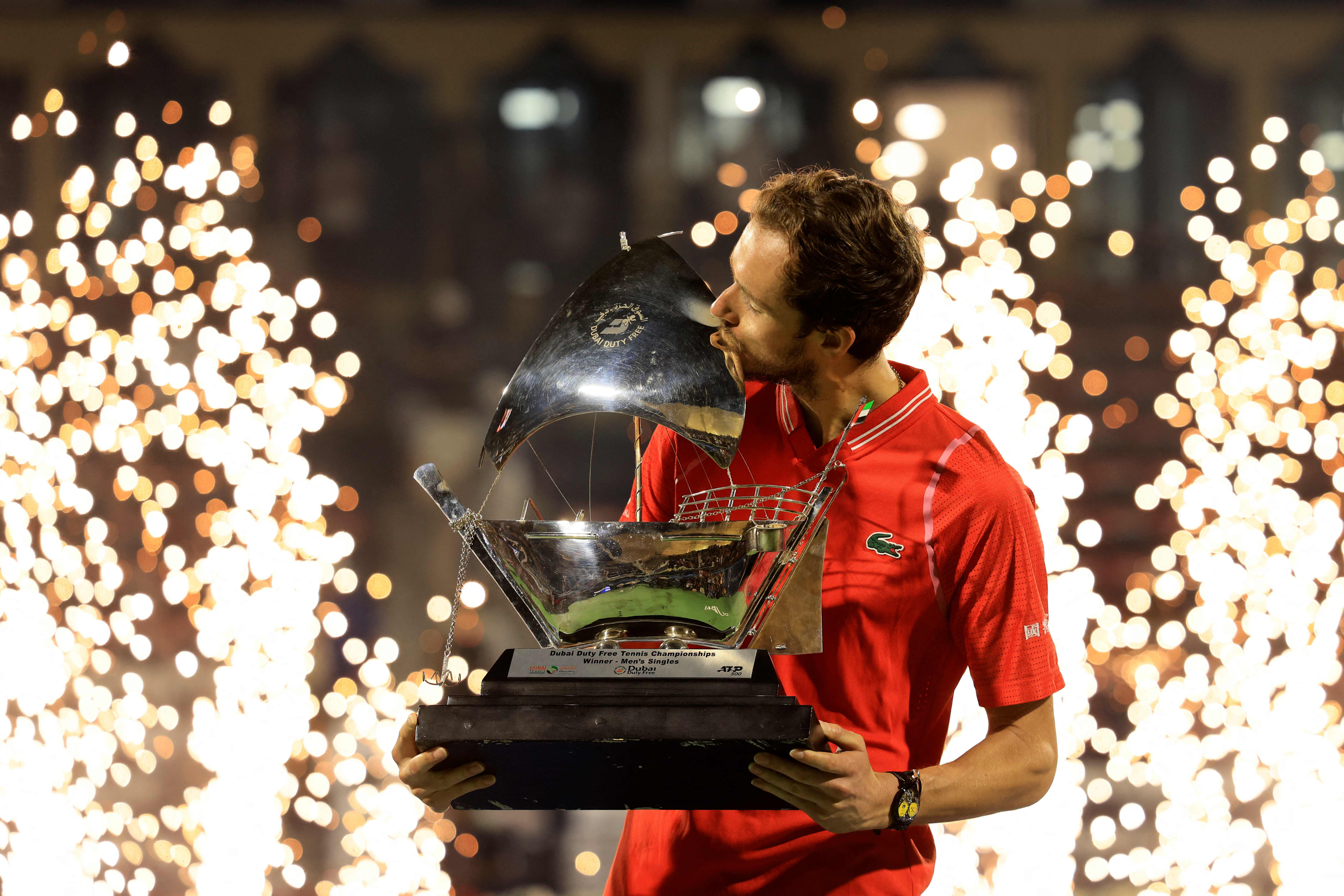 Russia's Daniil Medvedev kisses his trophy after winning against Andrey Rublev (not pictured) during the ATP Dubai Duty Free Tennis Championship final match in Dubai. Credit: AFP Photo