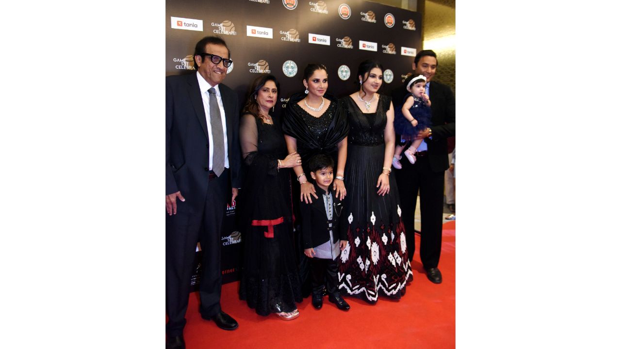 Sania Mirza's family pose for a photo on their arrival for her farewell party in Hyderabad. Credit: PTI Photo